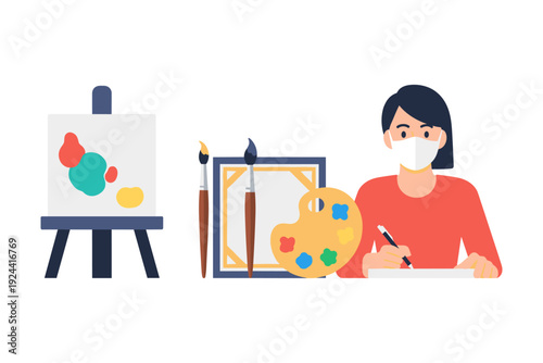 Artist wearing a mask paints on canvas with brushes and palette, creative hobby during pandemic