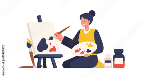 Young woman artist painting on canvas with brushes and palette, creative hobby