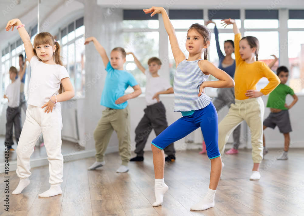 Fototapeta premium Group of children boys and girls dance modern dance in studio