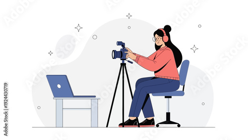Woman filming with video camera on tripod next to laptop, online content creation
