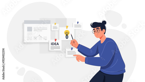 Man pointing at idea board with lightbulb and charts, brainstorming concept