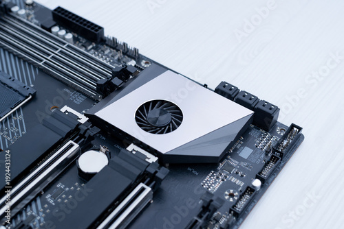 Photos Modern motherboard chipset with integrated cooling fan, advanced computer hardwa