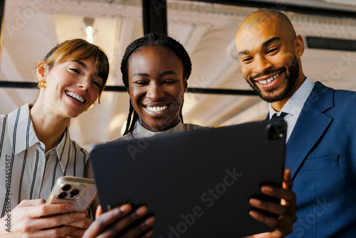 Business team collaborating using digital tablet