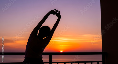 silhouette of a woman on the beach at sunset