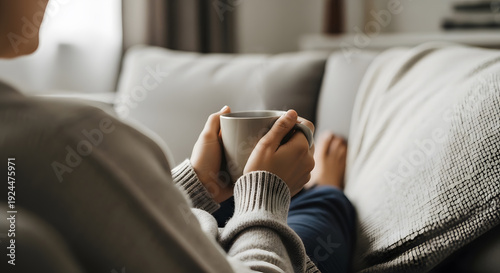 woman drinking coffee in living room