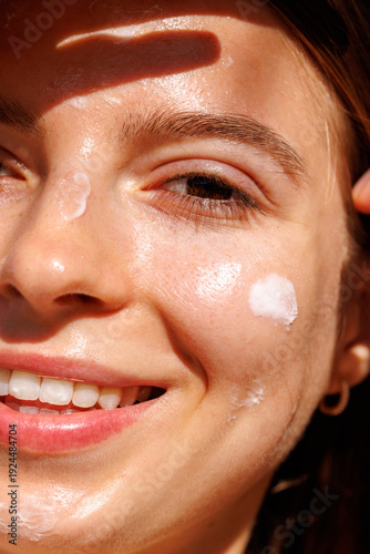Smiling Woman With Face Cream in Sunlight Skincare 