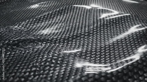 Wallpaper Mural Close-up view of a carbon fiber surface with a textured pattern and white streaks Torontodigital.ca