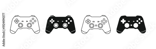 Four video game controllers in different styles.