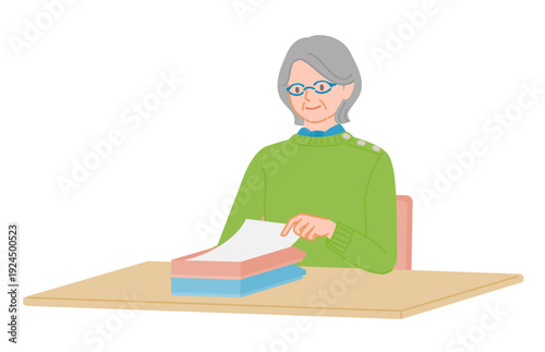 Senior woman placing document on tray at desk