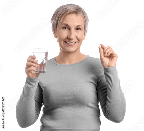 Mature woman with pill and ...