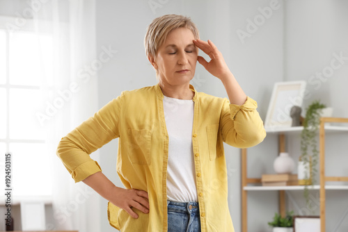Canvastavla Mature woman experiencing menopause at home