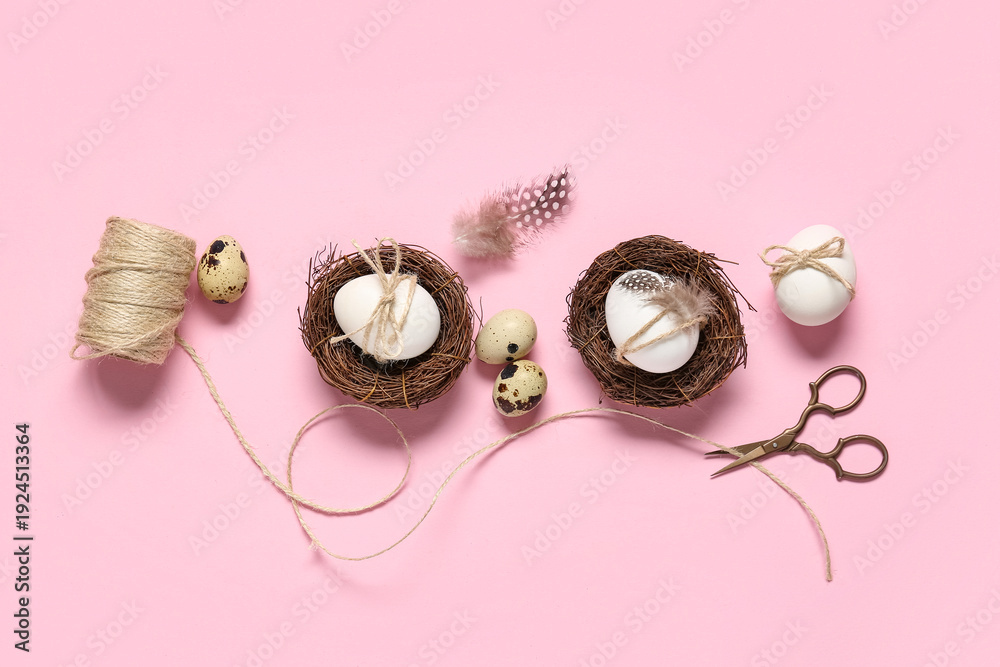 Fototapeta premium Easter eggs with feathers, rope and scissors on pink background