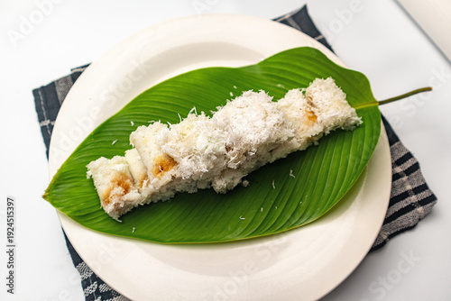 Kue putu is a type of traditional Indonesian snack in the form of a cake filled with Javanese sugar, coated with grated coconut and rice flour