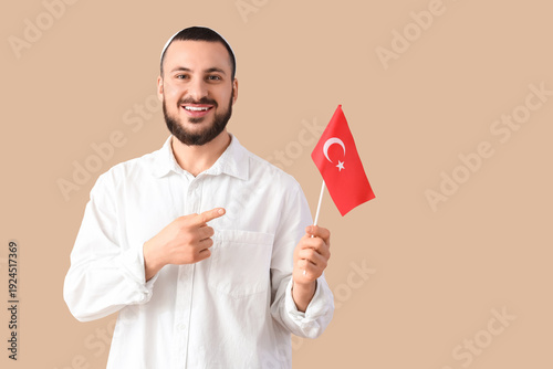 Young Muslim man pointing a...