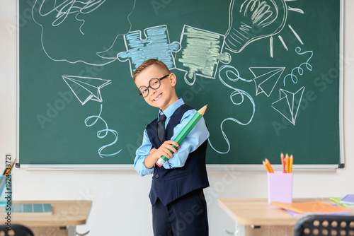 Cute little schoolboy with ...