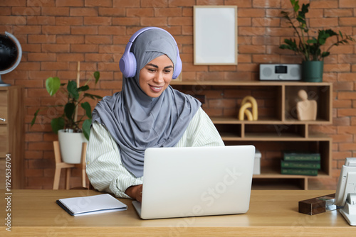 Young Muslim woman with hea...
