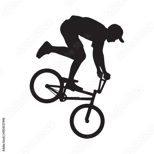 Silhouette of a bmx rider performing a trick mid air black and white