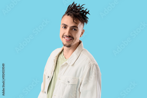Young man with dreadlocks o...