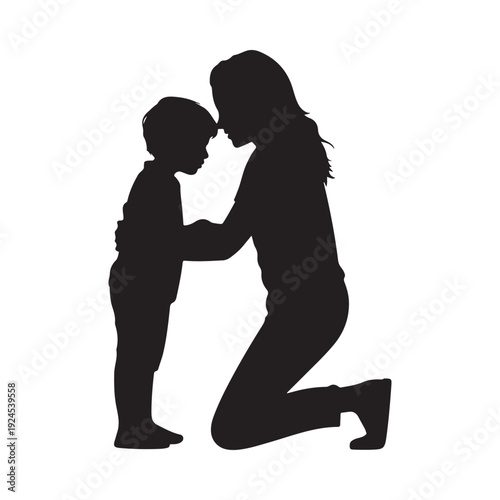 Silhouette of a mother kneeling and embracing her young child with affection