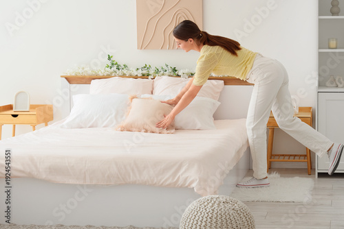 Young happy woman making be...