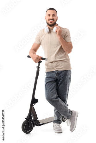Young man with electric kic...