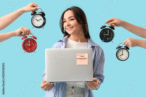 Businesswoman holding lapto...