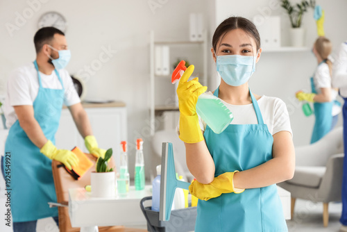 Female Asian janitor with m...