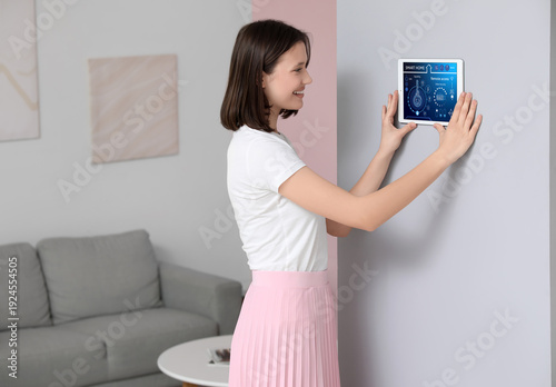 Young happy woman using sma...