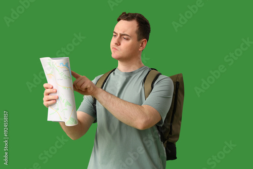 Young man with city map and...