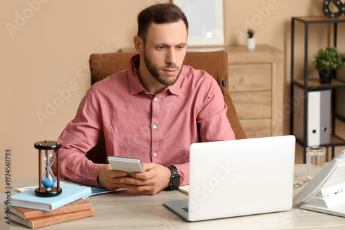 Male bank manager working i...