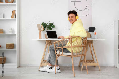 Young man in headphones wor...