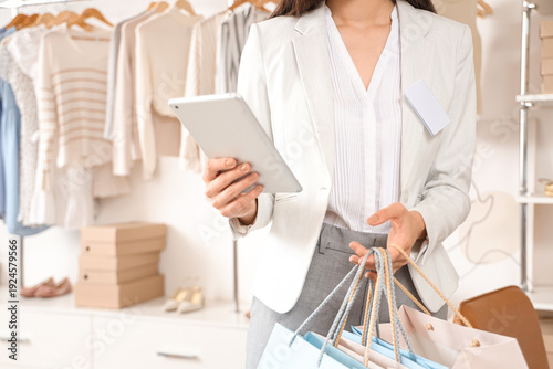Female seller with bags and...