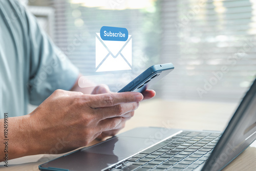 Принти на полотні Newsletter signup concept showing a user subscribing via smartphone and laptop