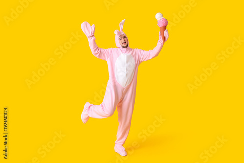 Young man in bunny costume ...