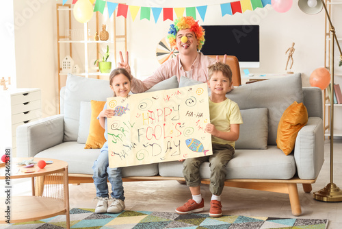 Father in colorful clown an...