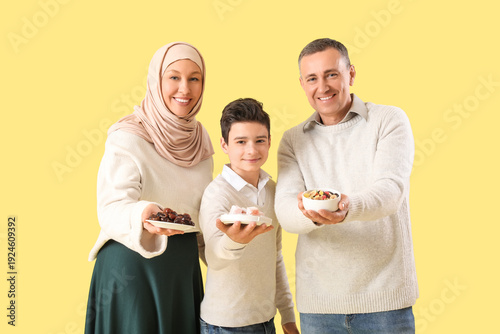 Happy Muslim family with tr...