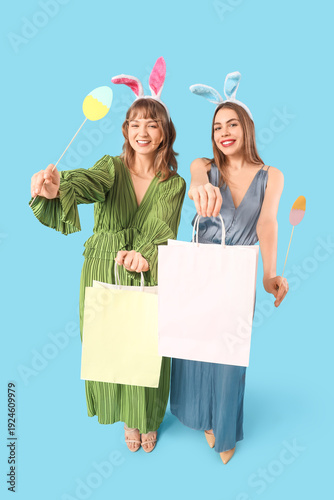 Happy young women in bunny ...