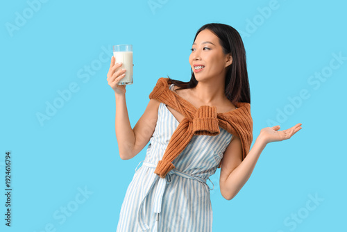 Young Asian woman with glas...