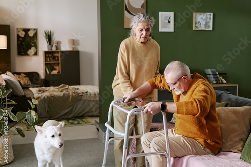 Εκτύπωση καμβά Senior Caucasian woman assisting senior Caucasian man using walker in living roo