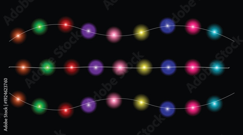 Colorful string lights with multiple colored bulbs and white cords on black background for decoration and ambiance  festive lighting