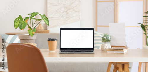 Blank laptop with coffee cu...