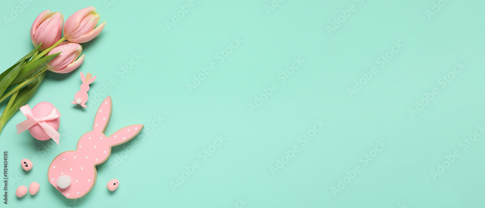 Fototapeta premium Composition with Easter eggs, decorative bunnies and tulip flowers on turquoise background