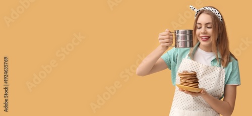 Young woman adding sugar po...