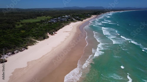 Wallpaper Mural Sandy Coastline Of Belongil Beach With Turquoise Waves Rolling Ashore. Byron Bay In New South Wales, Australia. aerial pullback shot Torontodigital.ca