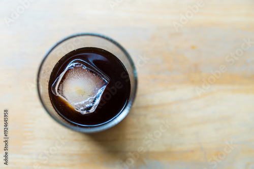 Wallpaper Mural Cold brew iced coffee with square ice cubes in a glass on wood table Torontodigital.ca