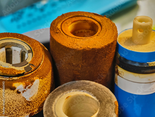 Dirty water filter displaying sediment buildup in a home filtration system during maintenance check