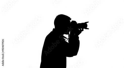 Silhouette of a man taking a photo with a camera