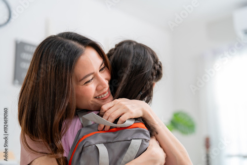 Εκτύπωση καμβά Asian beautiful mother prepare school backpack to young daughter at home