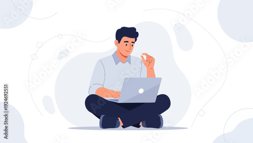 Man working on laptop, sitting cross-legged, modern abstract background