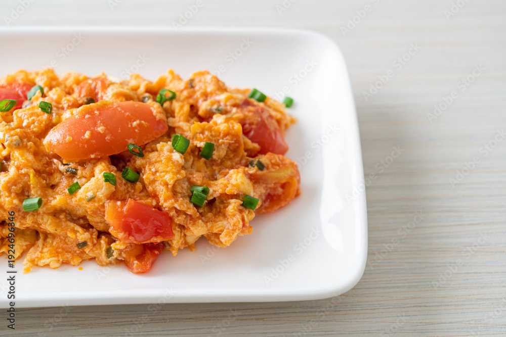 Fototapeta premium Stir-fried tomatoes with egg or Scrambled eggs with tomatoes